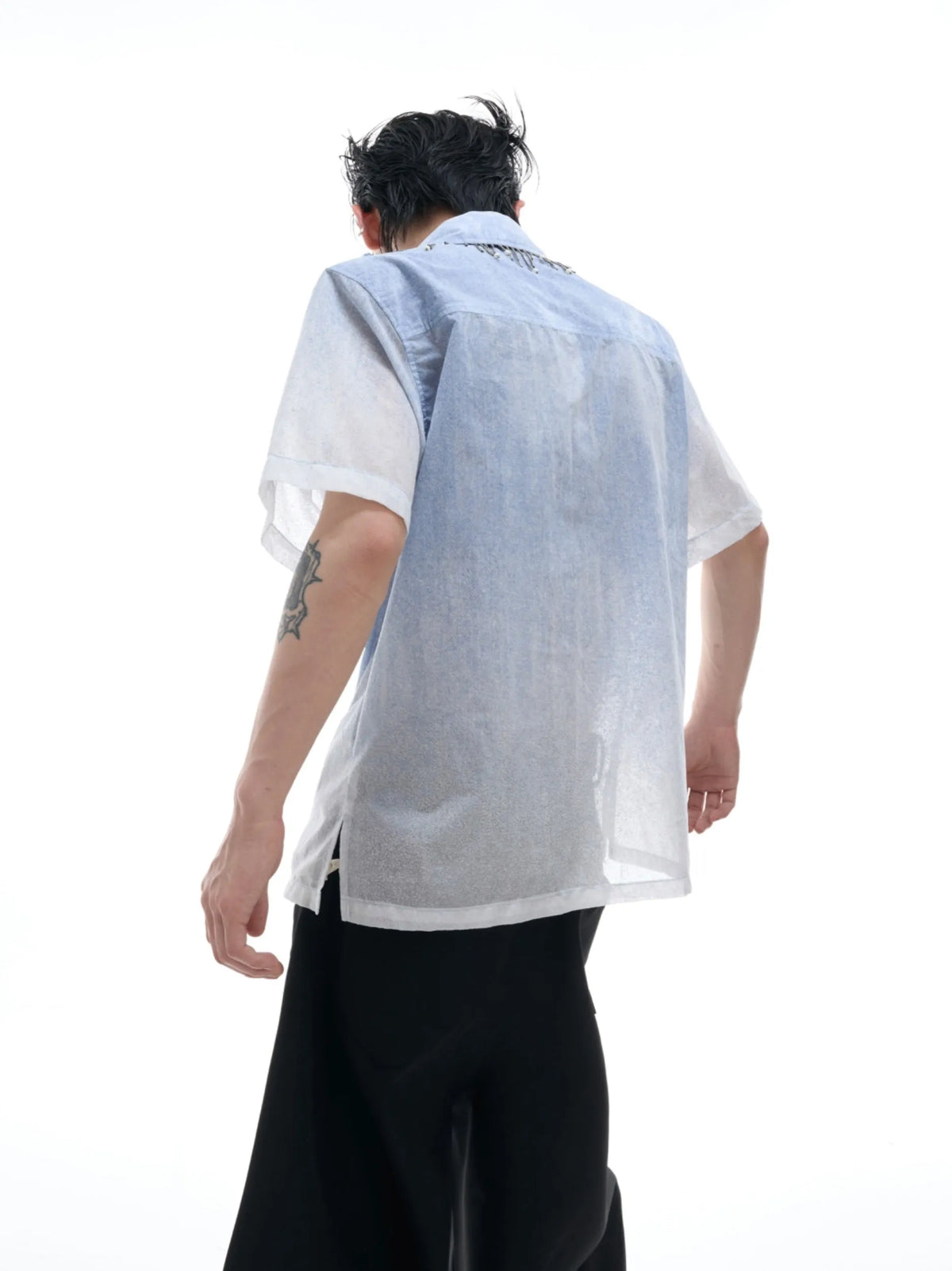 A loose-fitting men's blue to white gradient short-sleeve shirt for casual summer wear.