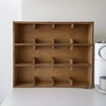 Square solid wood storage rack with multiple grid compartments in birch wood meridian colour