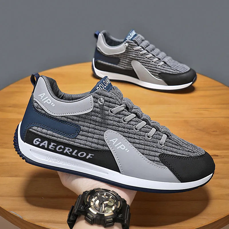 Men's grey and green mesh running shoes with viscose soles and lace-up fastening
