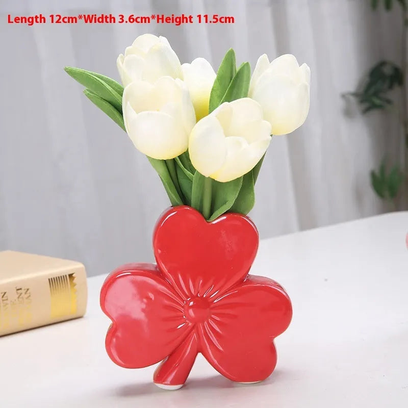 White porcelain clover-shaped ceramic vase in light green, pink, red, or white colours.