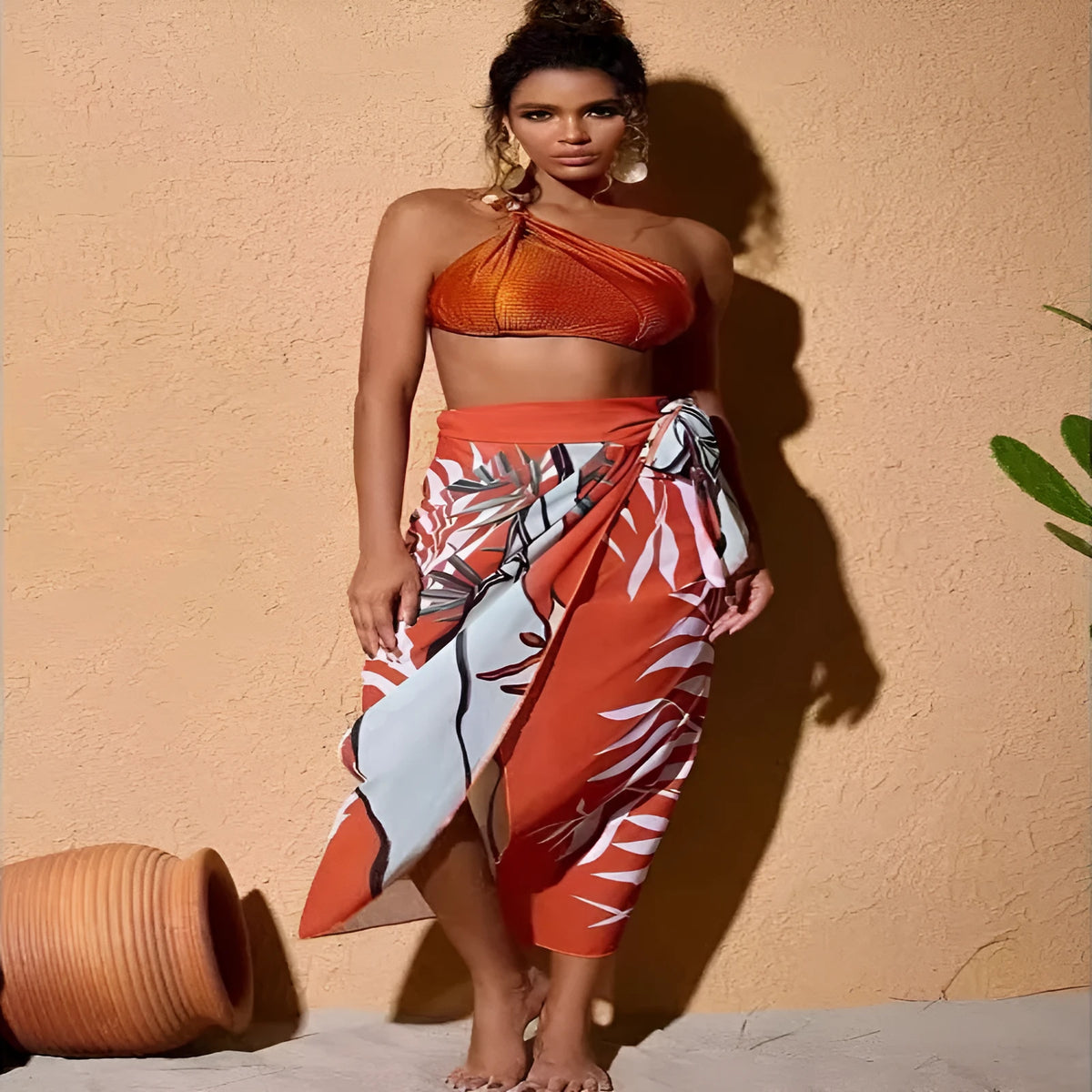 Brown women's high-waisted swimsuit with push-up top and a sheer black chiffon dress overlay.