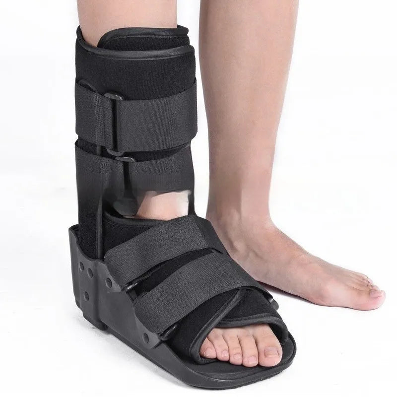 Grey and black Achilles tendon rehabilitation fixed support walking boot with adjustable straps.
