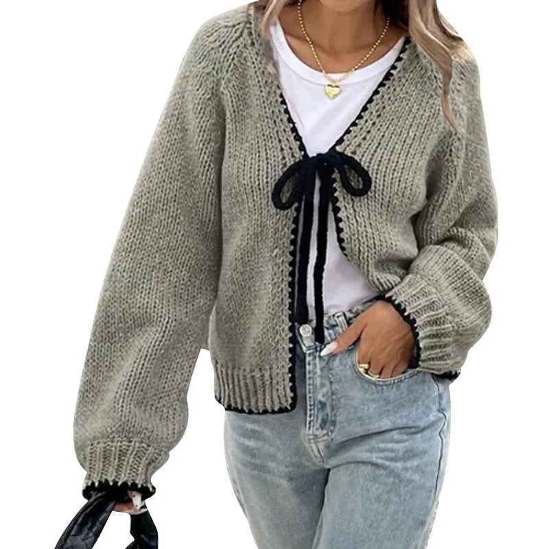Women's grey lace-up cardigan sweater with crochet flower detail on front