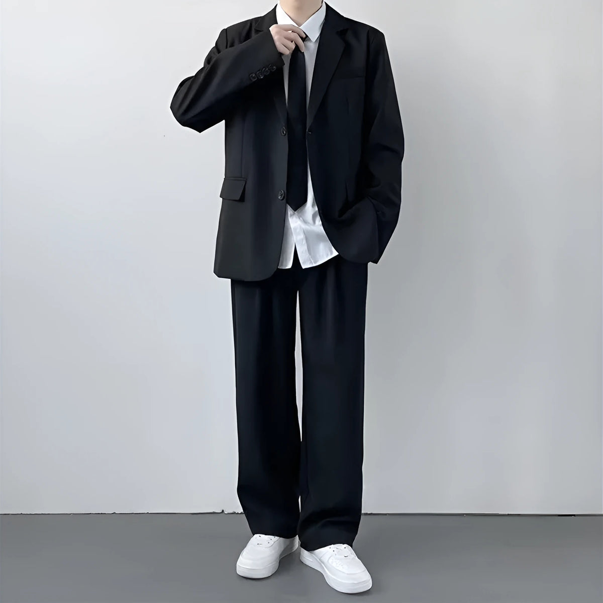Men's plus size grey suit jacket and trousers set with white shirt and tie on a hanger