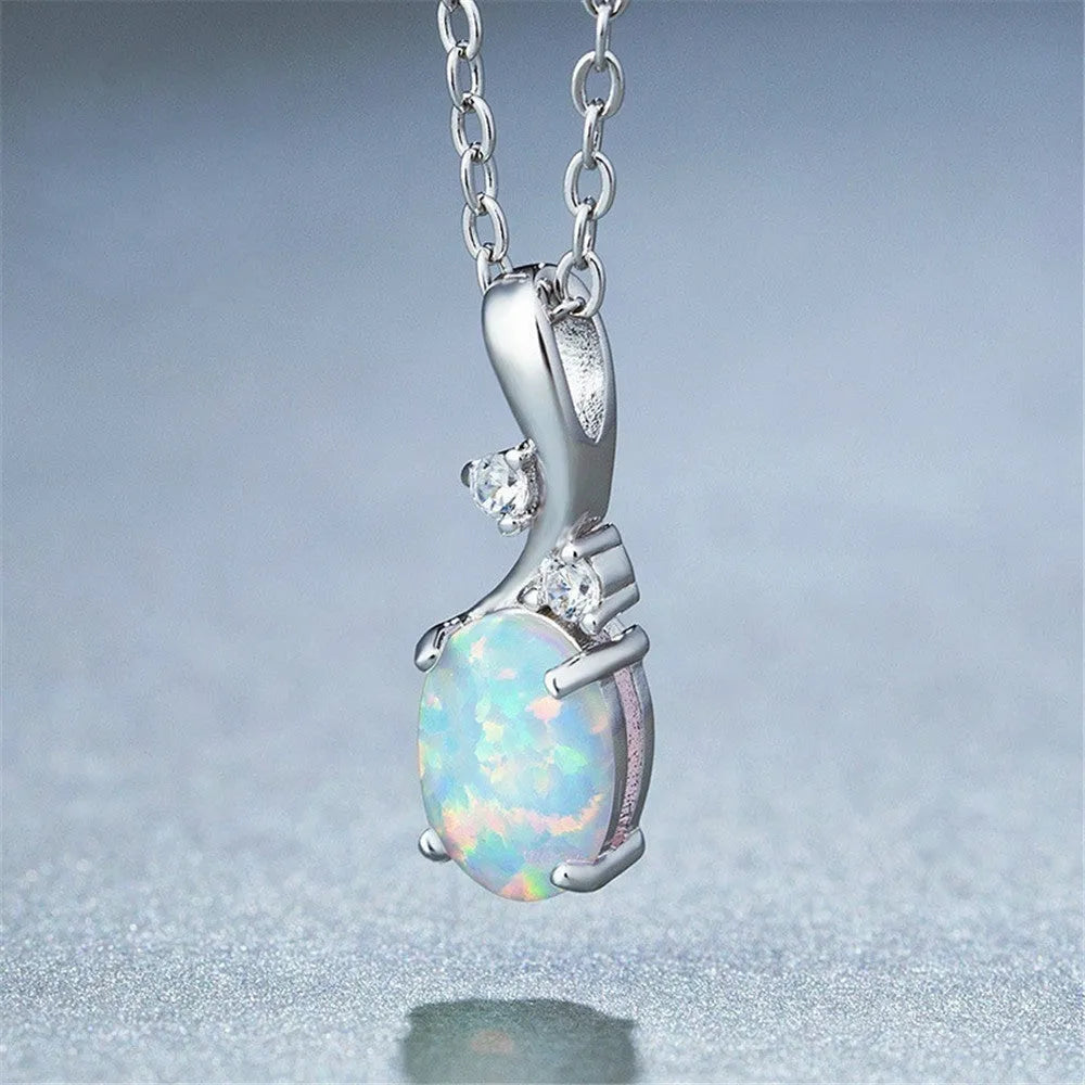Water drop shaped opal pendant necklace on an O-chain in rose gold or white finish.
