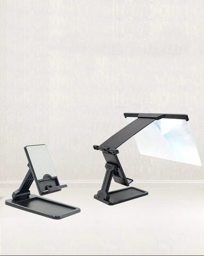 Black folding mobile phone screen amplifier with detachable holder, shown magnifying a smartphone display.