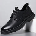 Men's black and brown leather casual sneakers with sewing line details on a two-layer cowhide upper.