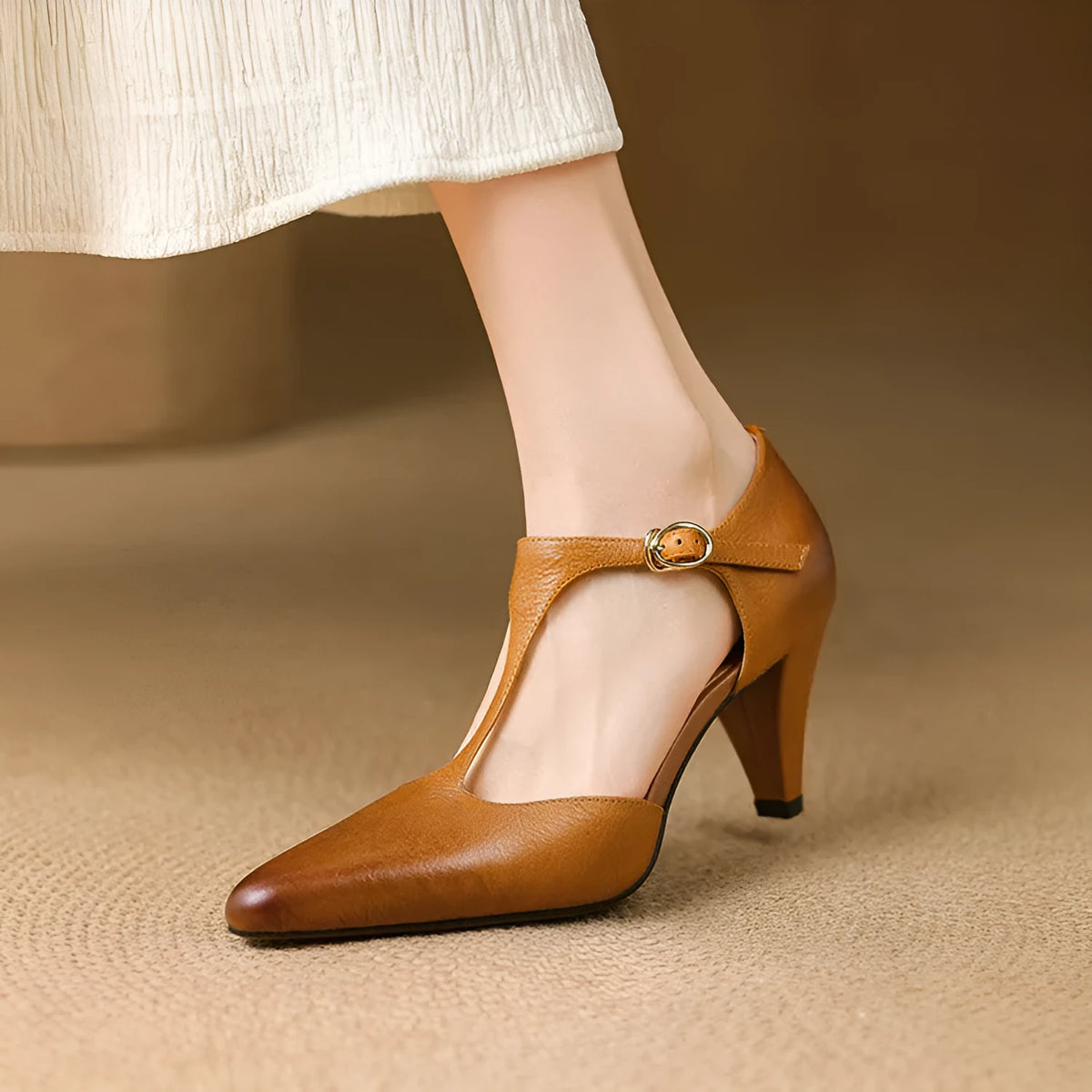 Brown women's retro T-strap sandals with a closed toe, buckle, and a short stout high heel.