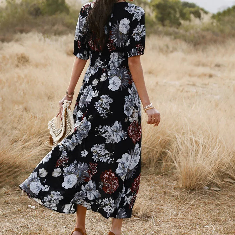 Yellow floral print summer dress with V neck and elastic waist on mannequin