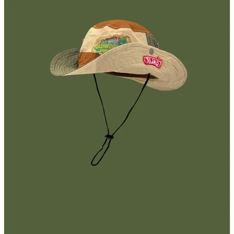 Army green women's fisherman hat with patchwork design and hand-painted details
