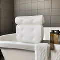 White bathtub pillow with 4D mesh material and seven suction cups showing 3D permeable construction