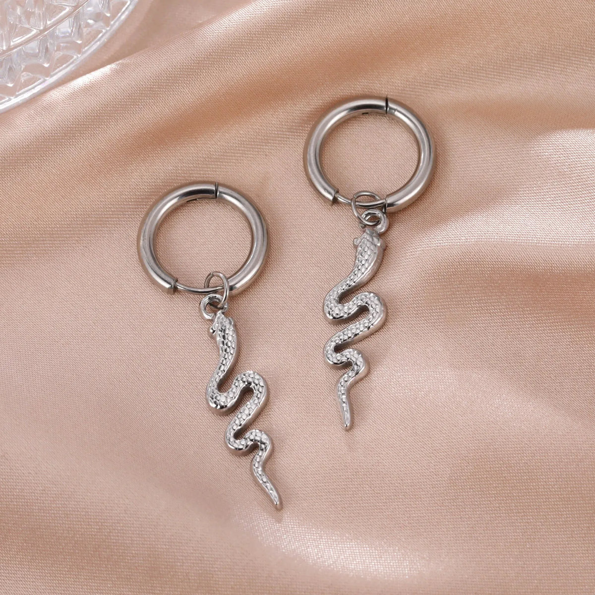 Gold or steel coloured stainless steel snake-shaped vintage clip-on earrings