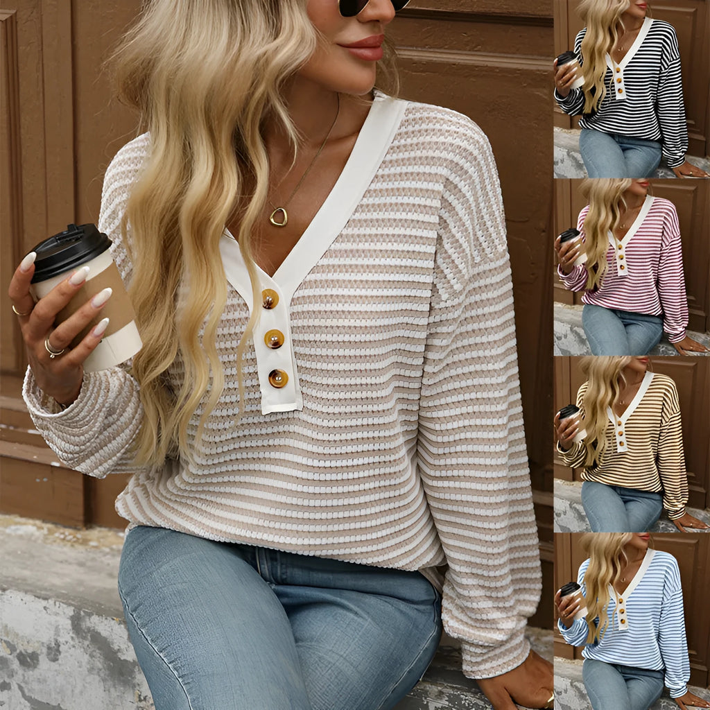 Women's loose-fitting long-sleeved V-neck top with button detail and patchwork design.