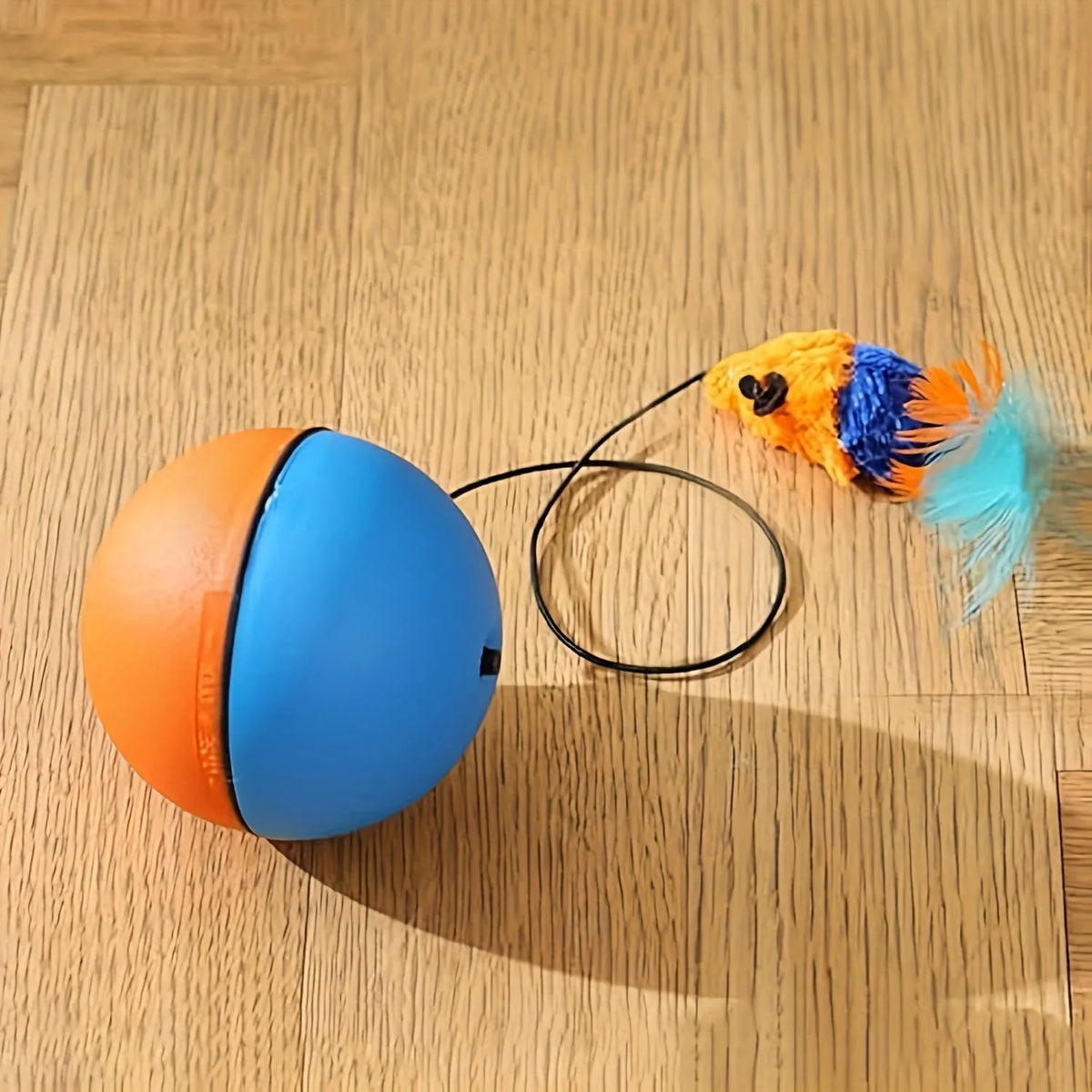 Interactive cat toy with plush mouse and exercise ball in blue and orange colours