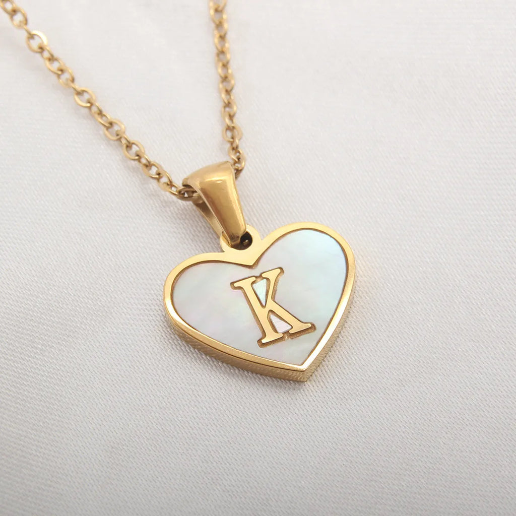 Gold-plated heart-shaped white shell necklace with adjustable chain and letter personalisation option