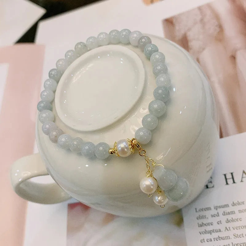 Chinese style jade bracelet with gourd design featuring natural emerald jade ins material.