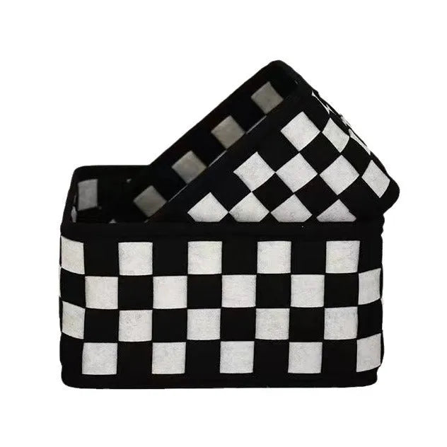 Checkerboard patterned woven felt storage basket folded flat next to it assembled