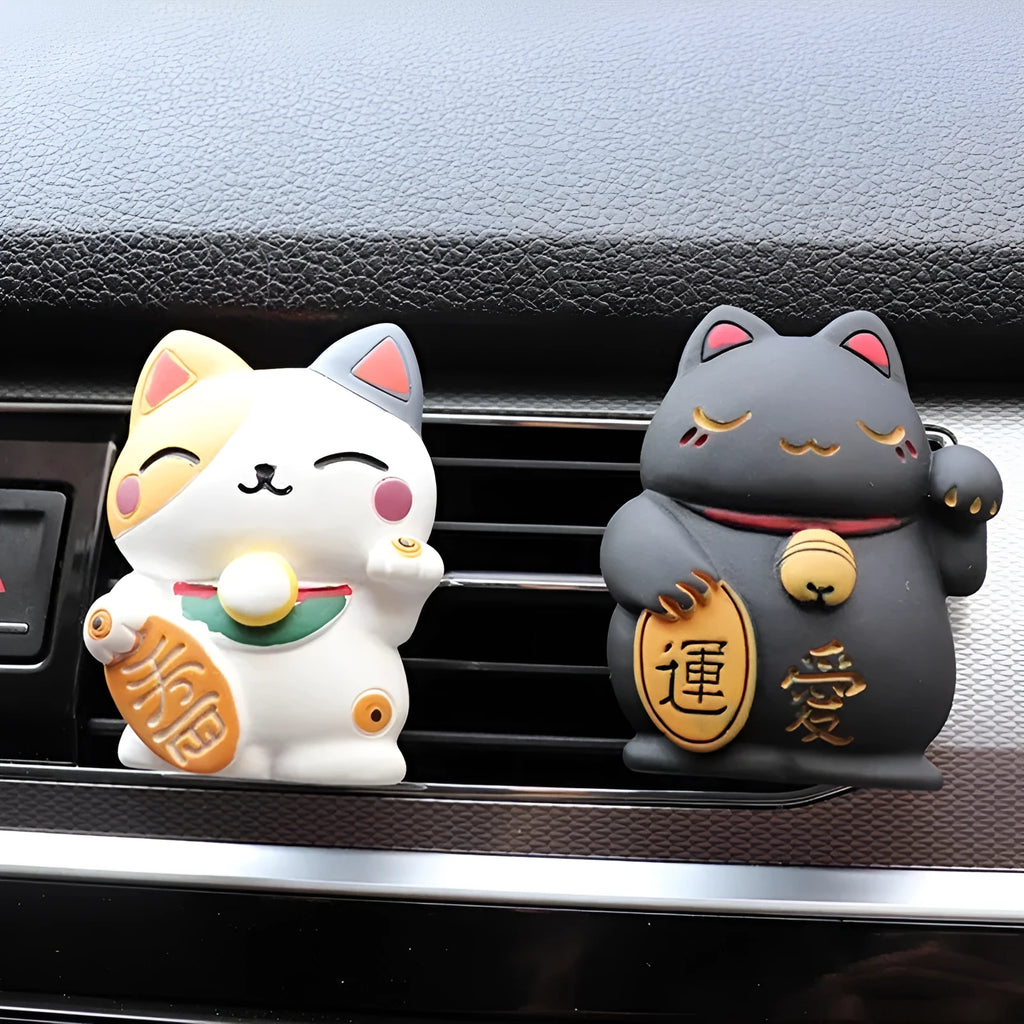 Resin fortune cat car vent aromatherapy clip in black or white.