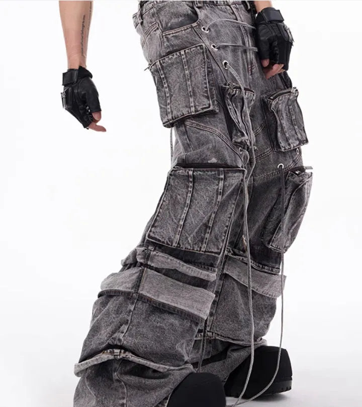 Grey distressed denim overalls for men with rope stitch detailing on the legs and chest.