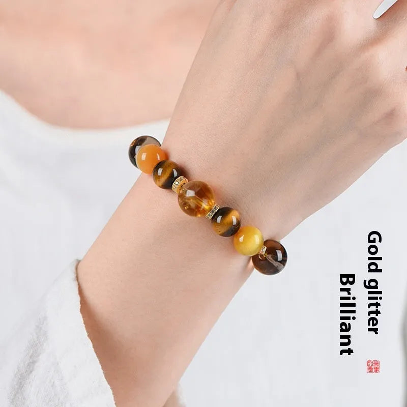 Yellow tower crystal bead bracelet with natural style on a wrist.