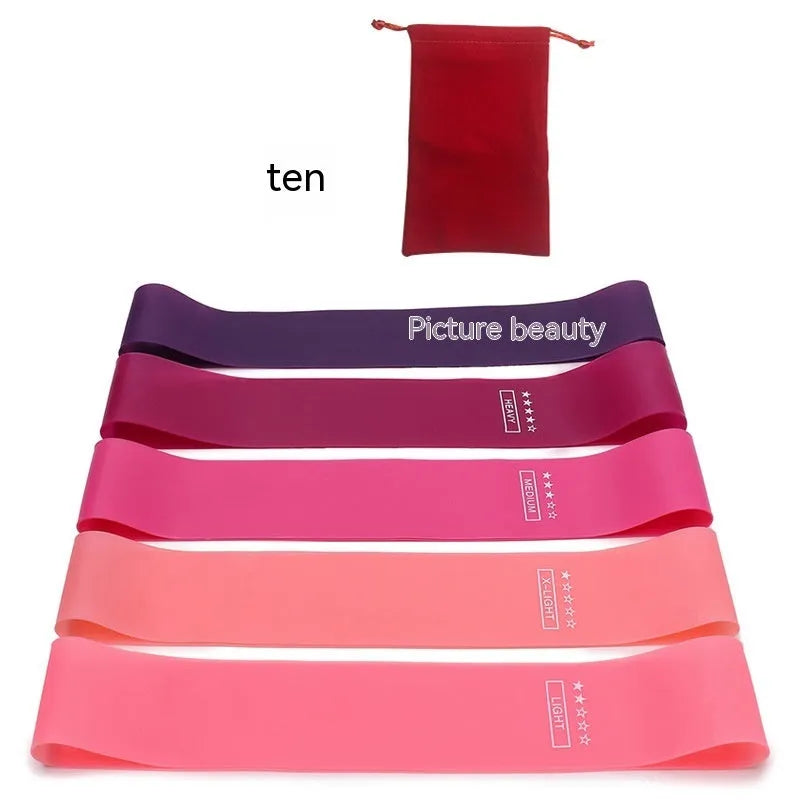 Five yoga tension straps in different colours with force markings for progressive resistance training