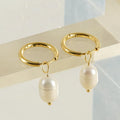 Gold-coloured geometric pearl earrings with stainless steel construction and titanium posts