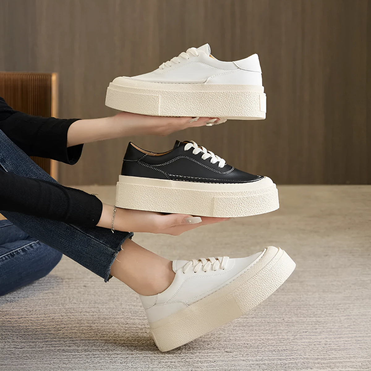 Women's black embossed leather platform sports shoes with a round toe and rubber sole.