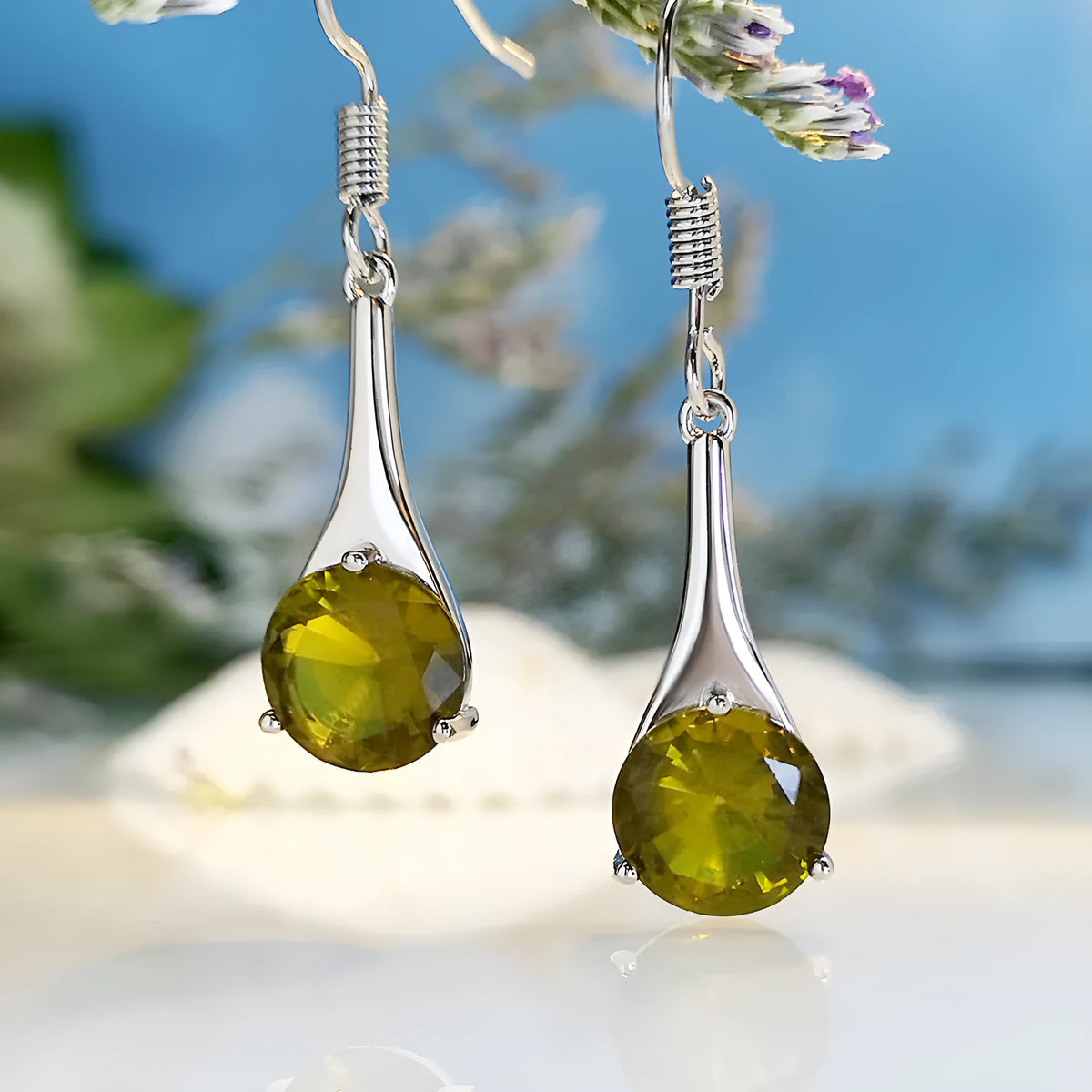 Olive green topaz earrings with water drop shape and retro design on alloy background