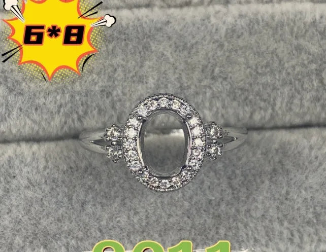Oval denier ring with 6x8mm stone and five-pointed star element on copper band