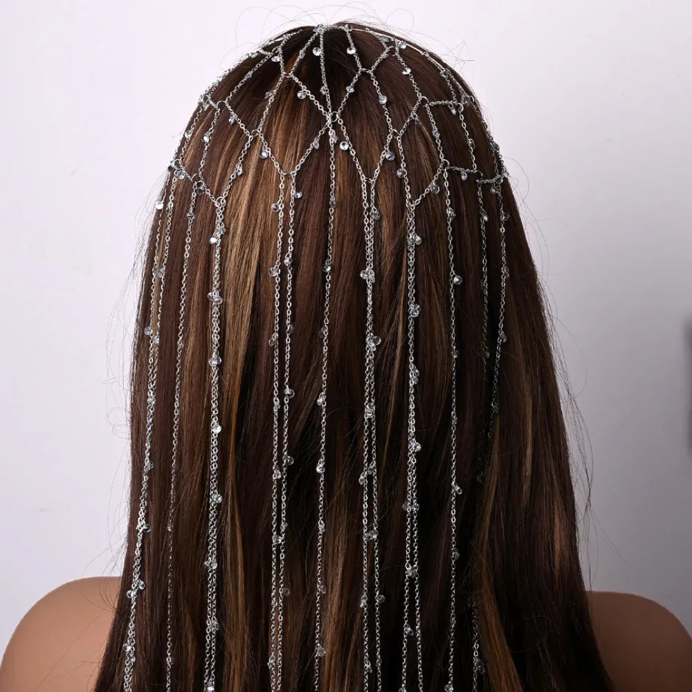 Gold rhinestone mesh headband with tassel detail and electroplated metallic finish