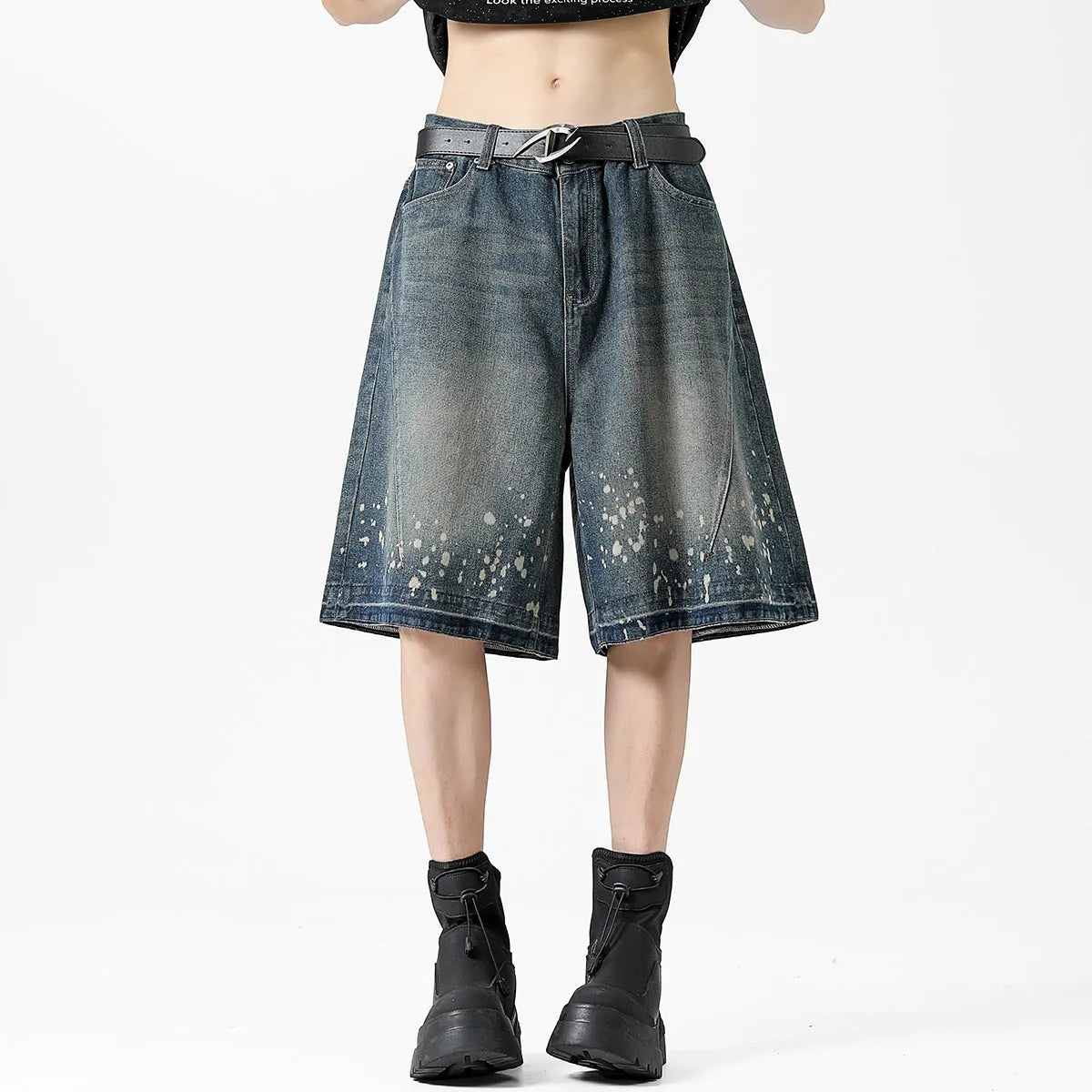 Men's retro washed blue denim shorts with splash ink detailing and ripped accents