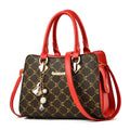 Women's geometric print messenger bag in PU leather with zipper and interior organisation pockets.