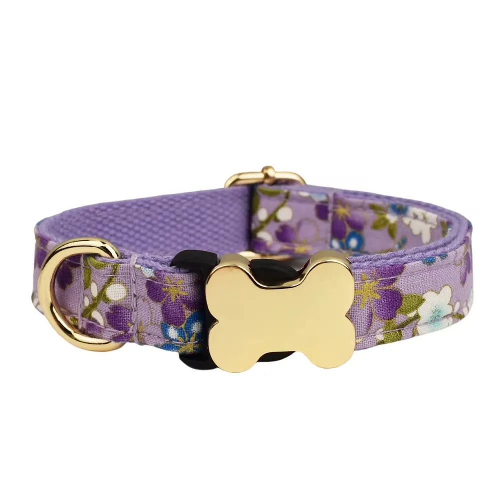 Flat nylon dog collar with a printed grid pattern and a bone-shaped metal buckle in multiple colour options.