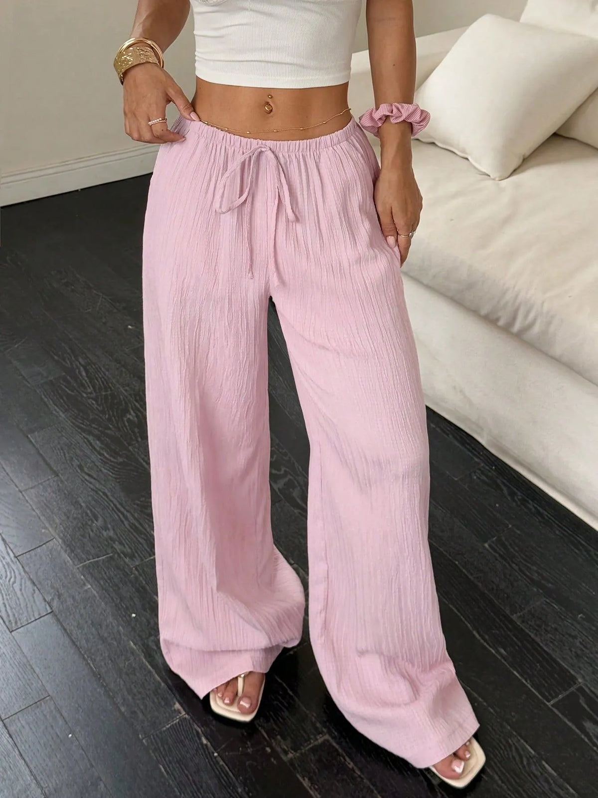 Women's wide-leg trousers with lace-up waist trim in black polyester fabric