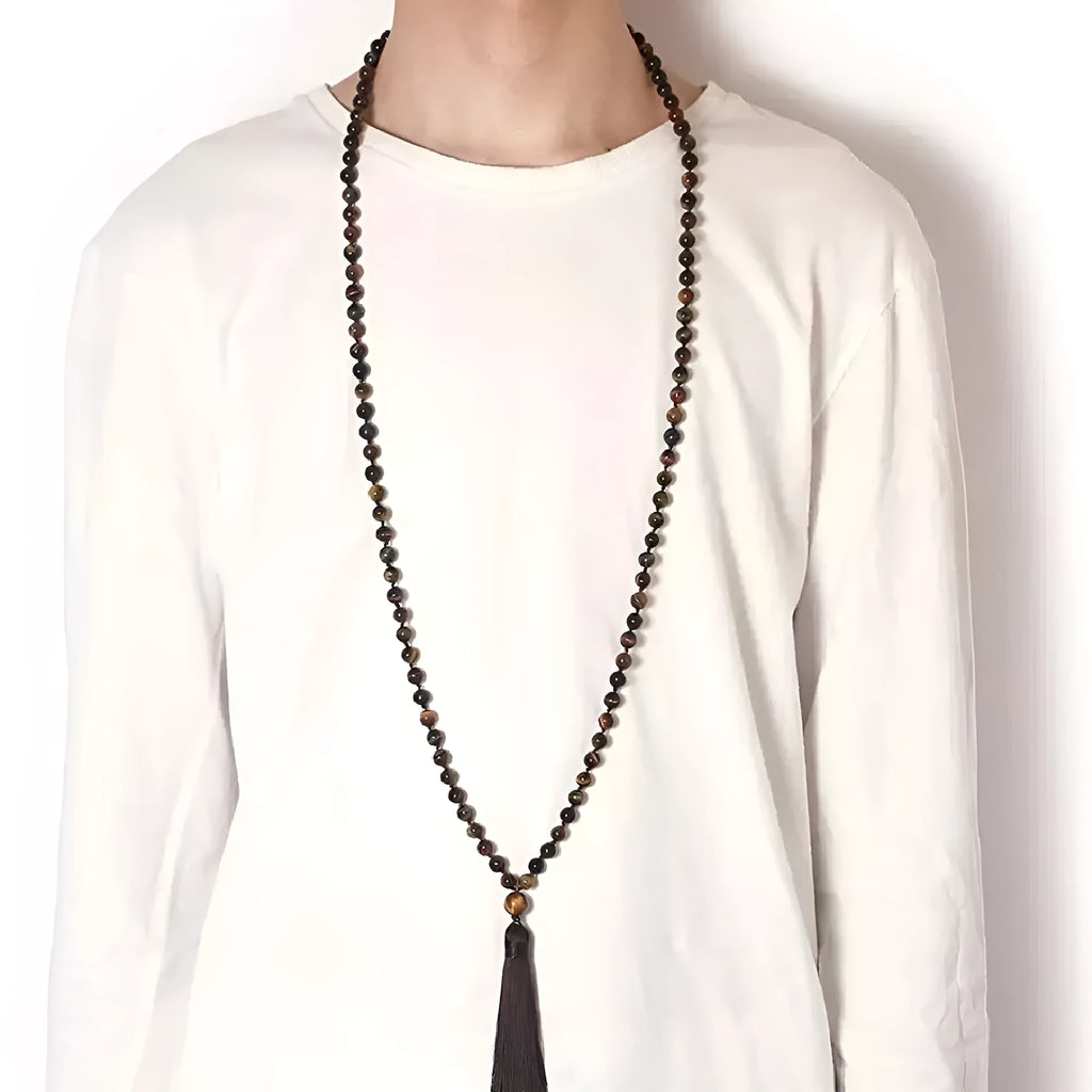 Long colourful agate and amethyst bead necklace with tassel detail, showing geometric pattern.