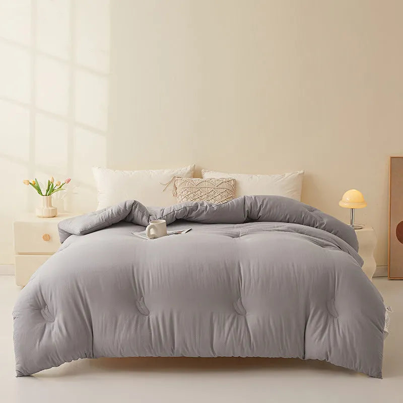 Soybean fibre filled quilt with pure cotton twill cover shown in grey, pink jade, and white colour options.