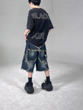 Blue denim shorts with frayed five-pointed star design, loose fit, shown from front view