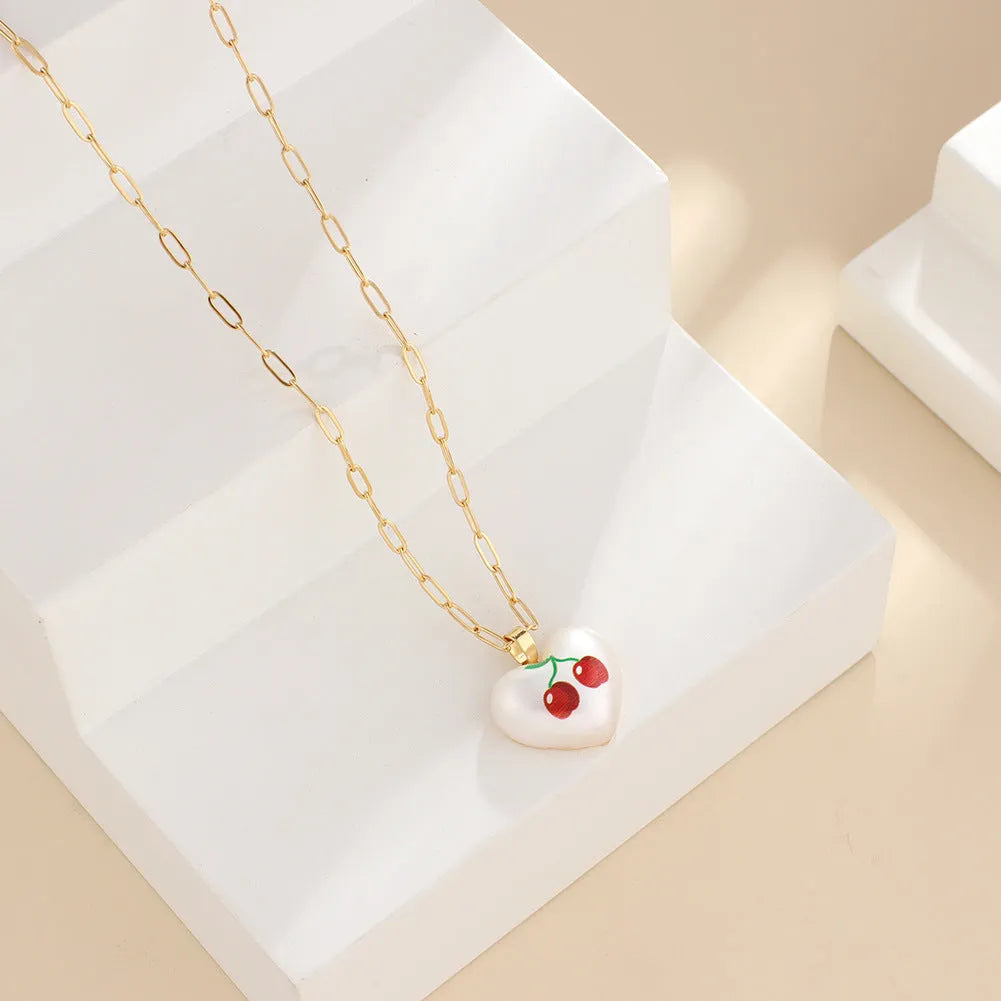 Geometric heart necklace with fruit pendant on adjustable chain in apple cherry pear pineapple strawberry designs