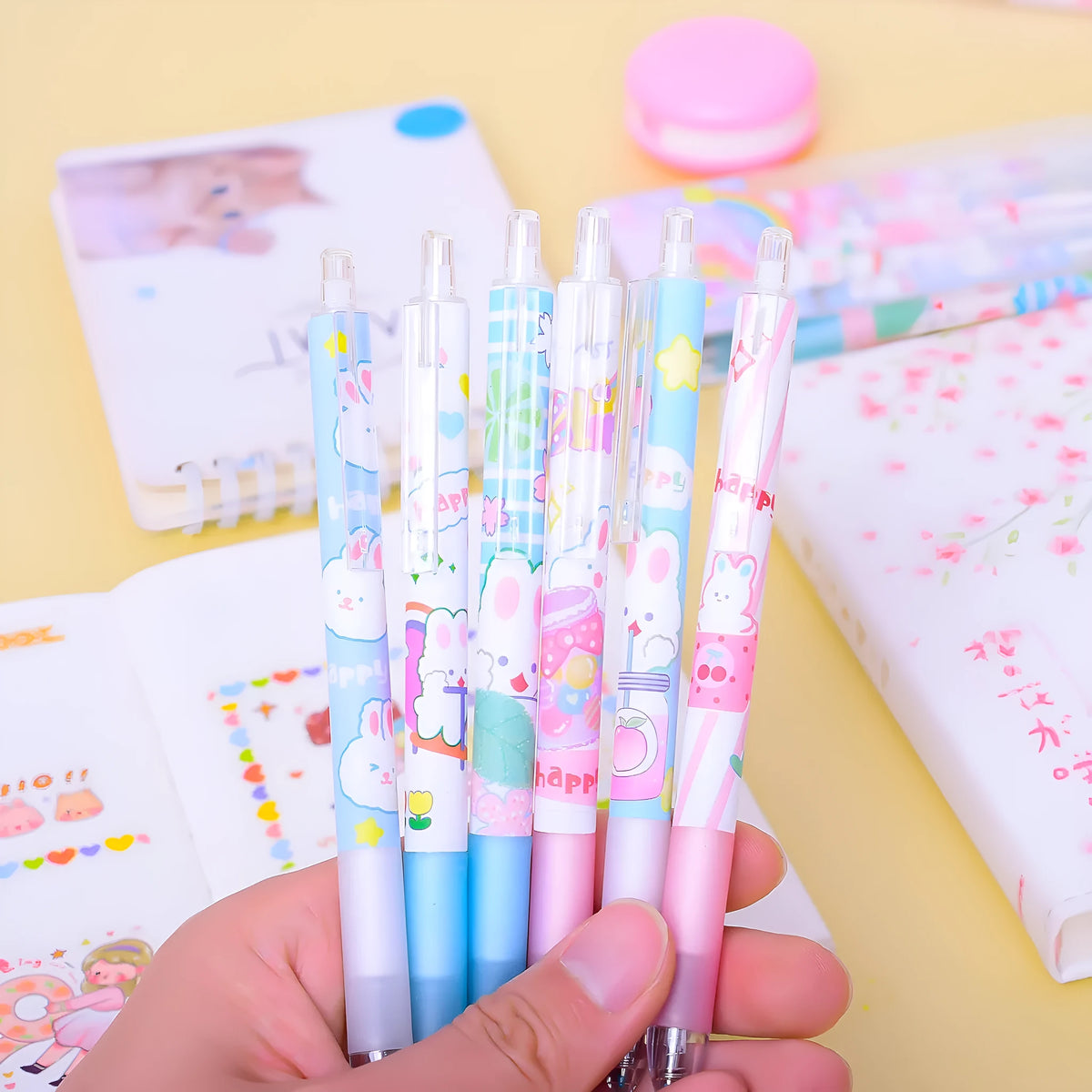Six black gel pens with 0.5mm tips and cartoon bunny designs on plastic shells