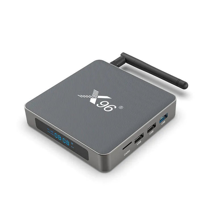 Smart Voice Set-top Box with remote, HDMI cable, and power adapter on a table.