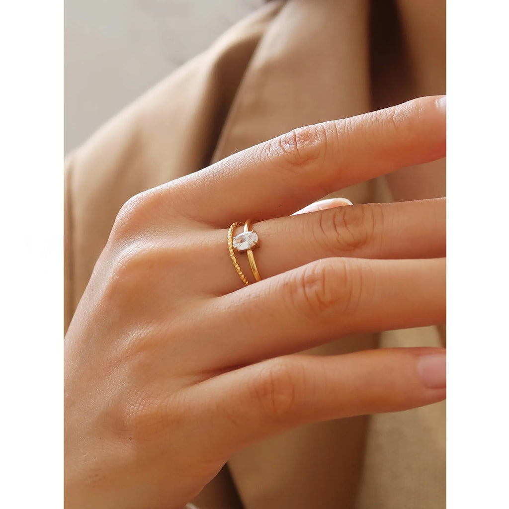 Stainless steel heart shape ring with a golden electroplated finish, shown in Heart and Oval colour variations.