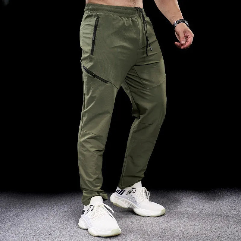 Men's waterproof quick-drying exercise trousers in nylon fabric for sports and fitness