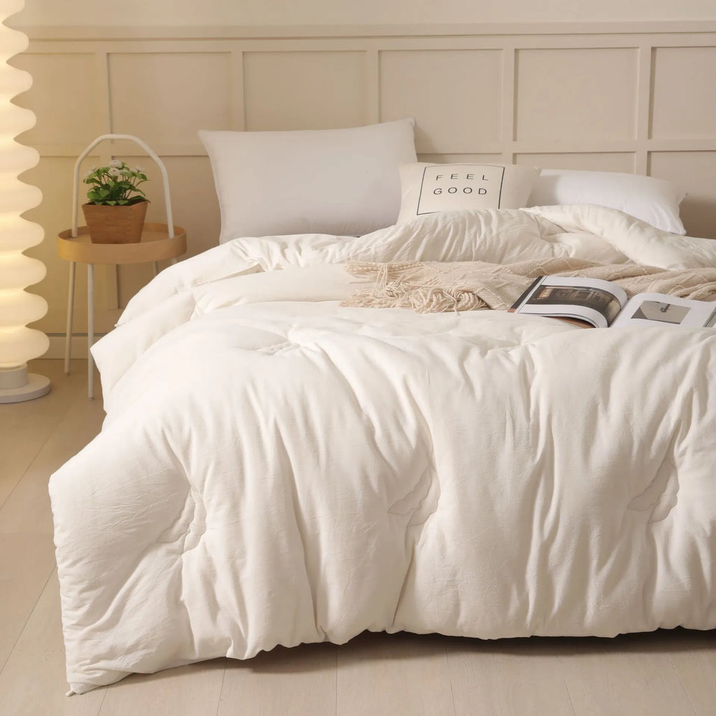 Soybean fibre filled quilt with pure cotton twill cover shown in grey, pink jade, and white colour options.