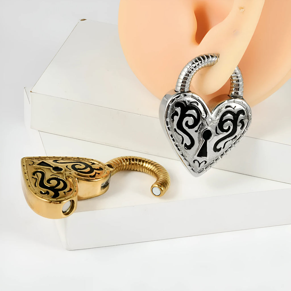 Women's heart-shaped stainless steel earrings in gold and steel colour options.