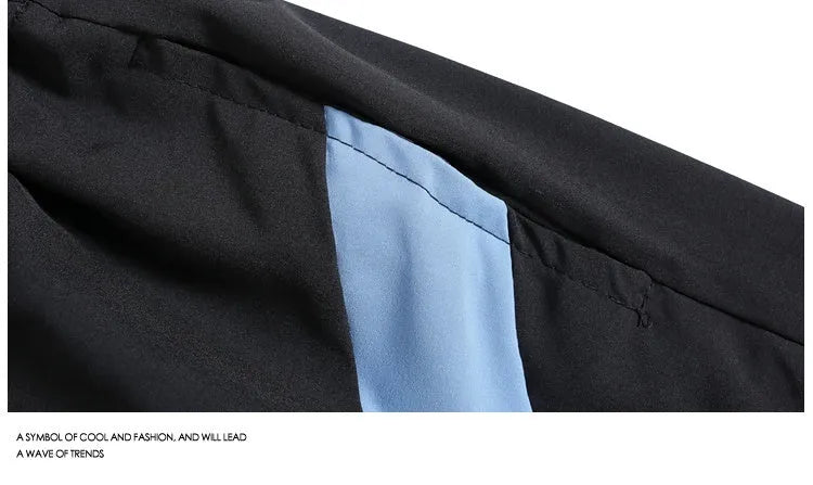 Men's black quick-drying sports shorts with elastic waistband and loose straight-leg design