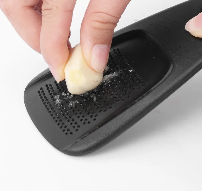 Six stackable kitchen gadget tools and a brush in a colour box, made from stainless steel and polypropylene.