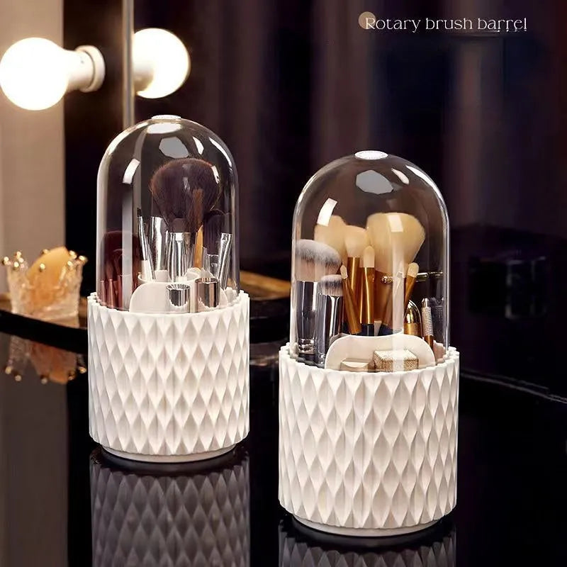 White rotating acrylic makeup brush holder with transparent lid on a desktop