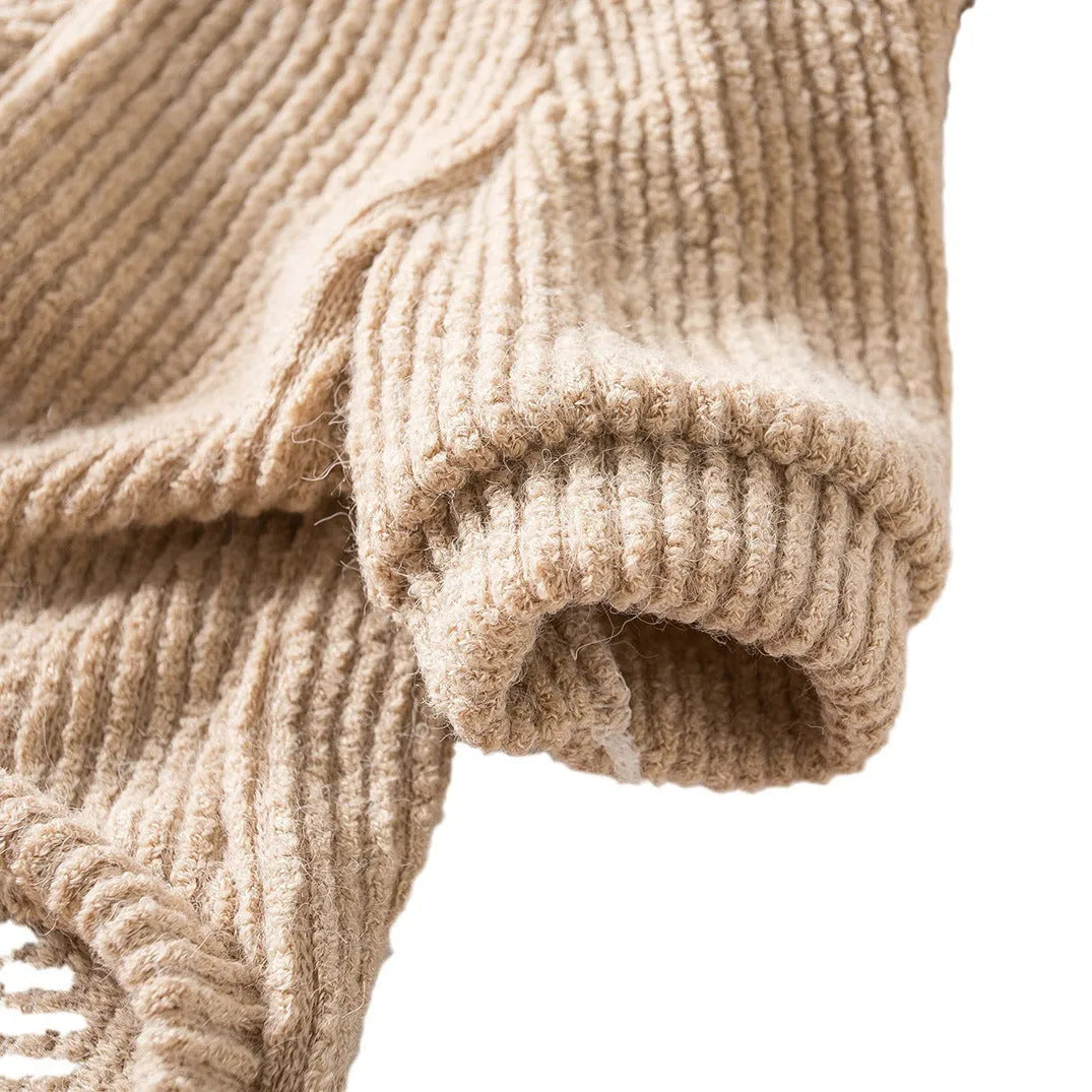 Brown cloth pullover sweater on a small dog like a Bichon or Pomeranian