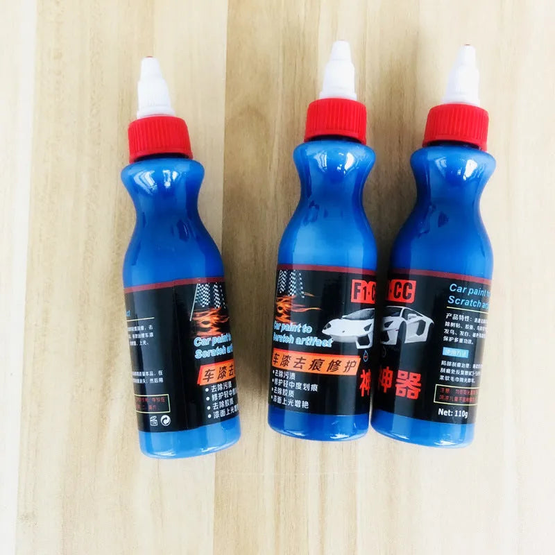Small blue wiping tool and bottle of automobile scratch repair agent for minor vehicle surface imperfections
