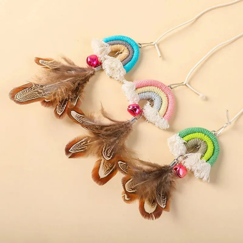 Blue feather cat rope toy hanging from door with elastic swing design and sticky buckle clamp